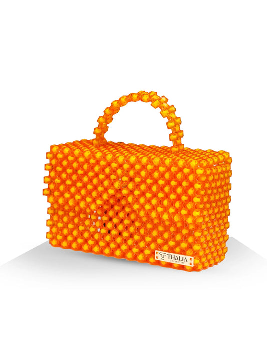 Unique, handmade orange beaded handbag on a white background, front/side view