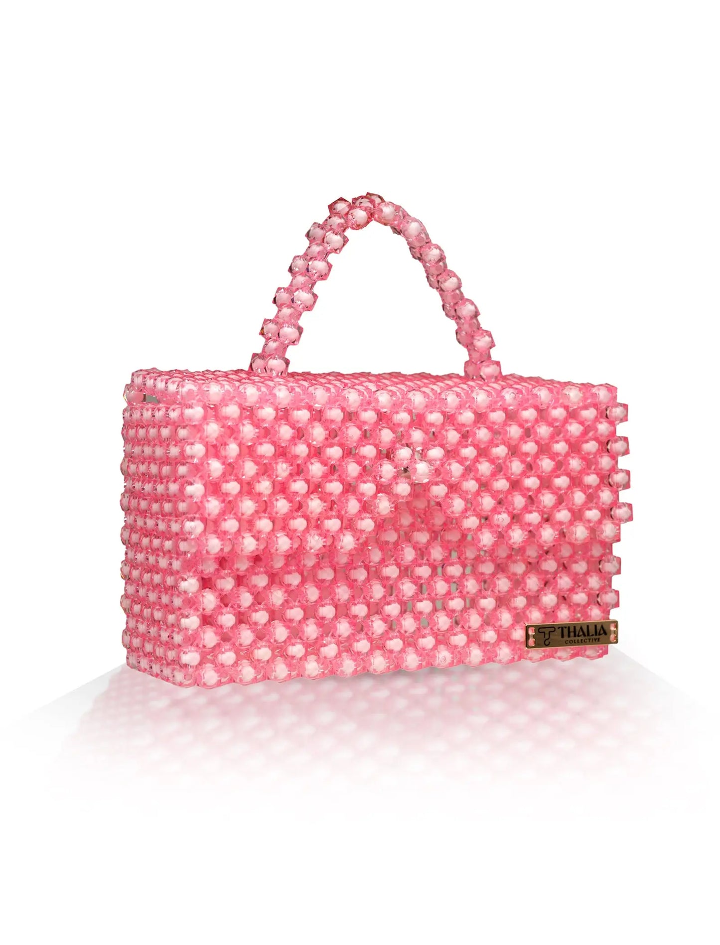 Unique, handmade pink beaded handbag on a white background, front view