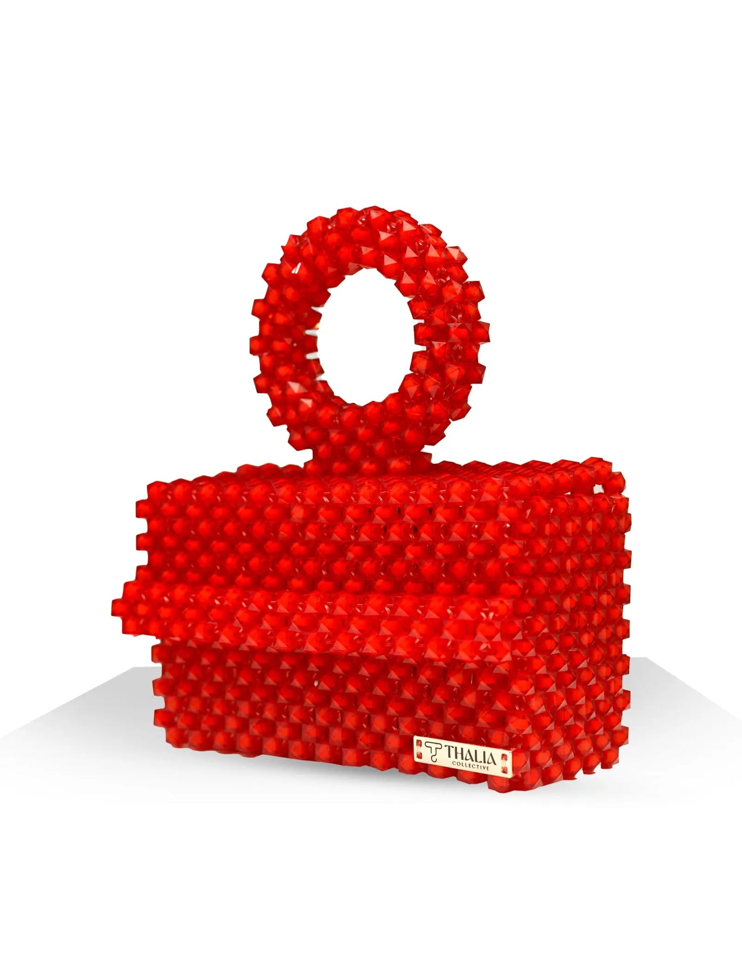 Unique, handmade red beaded handbag with halo detailing on a white background, side view